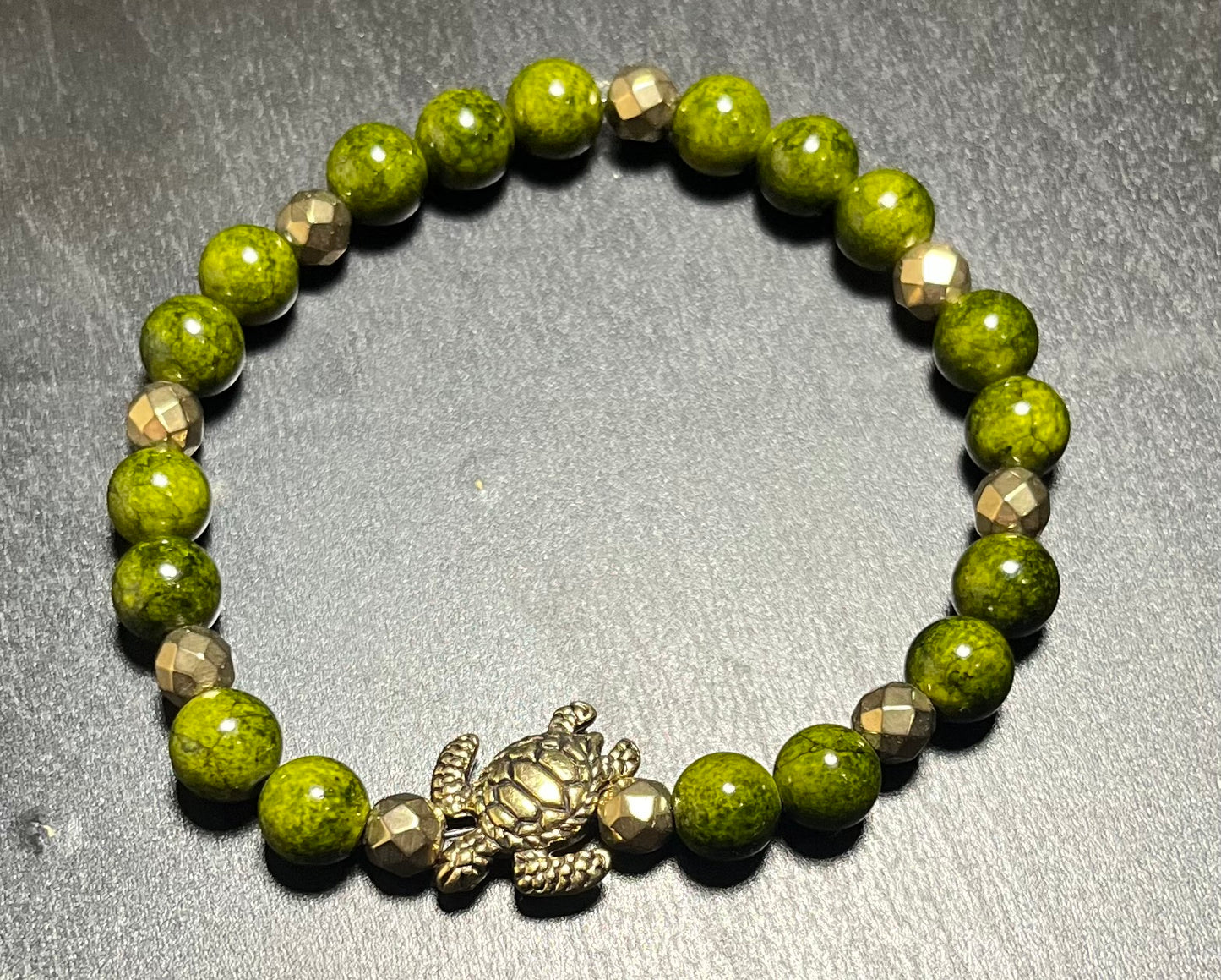 Green dyed quartz stone bracelet with turtle