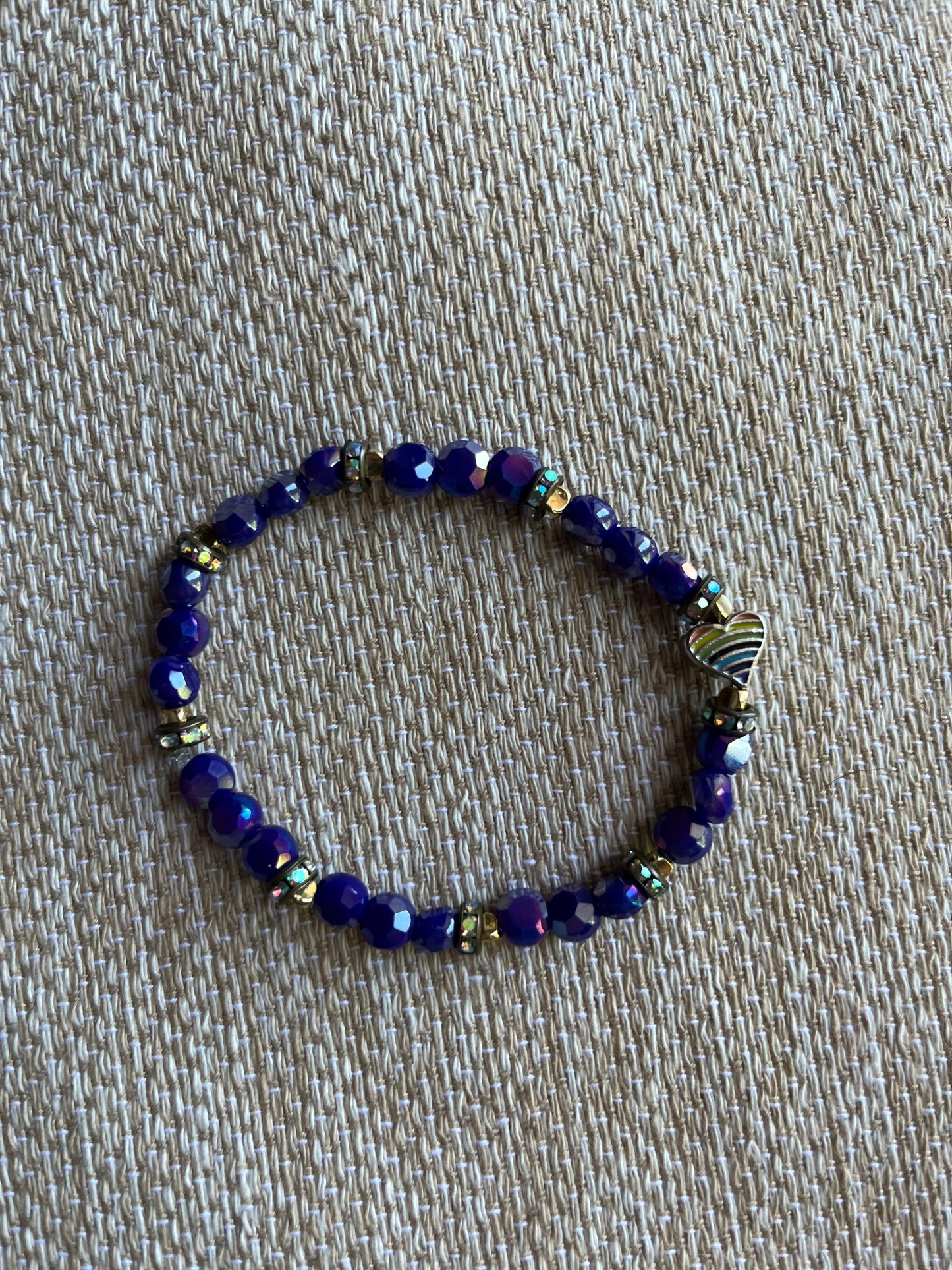 Purple glass beads with rainbow heart