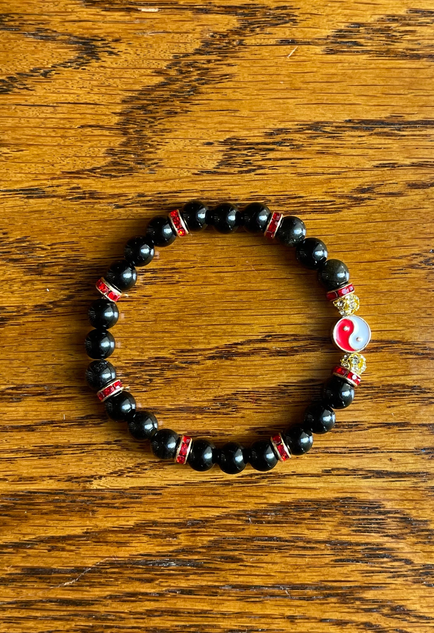 Black obsidian stone bracelet, with red yin & yang symbol
