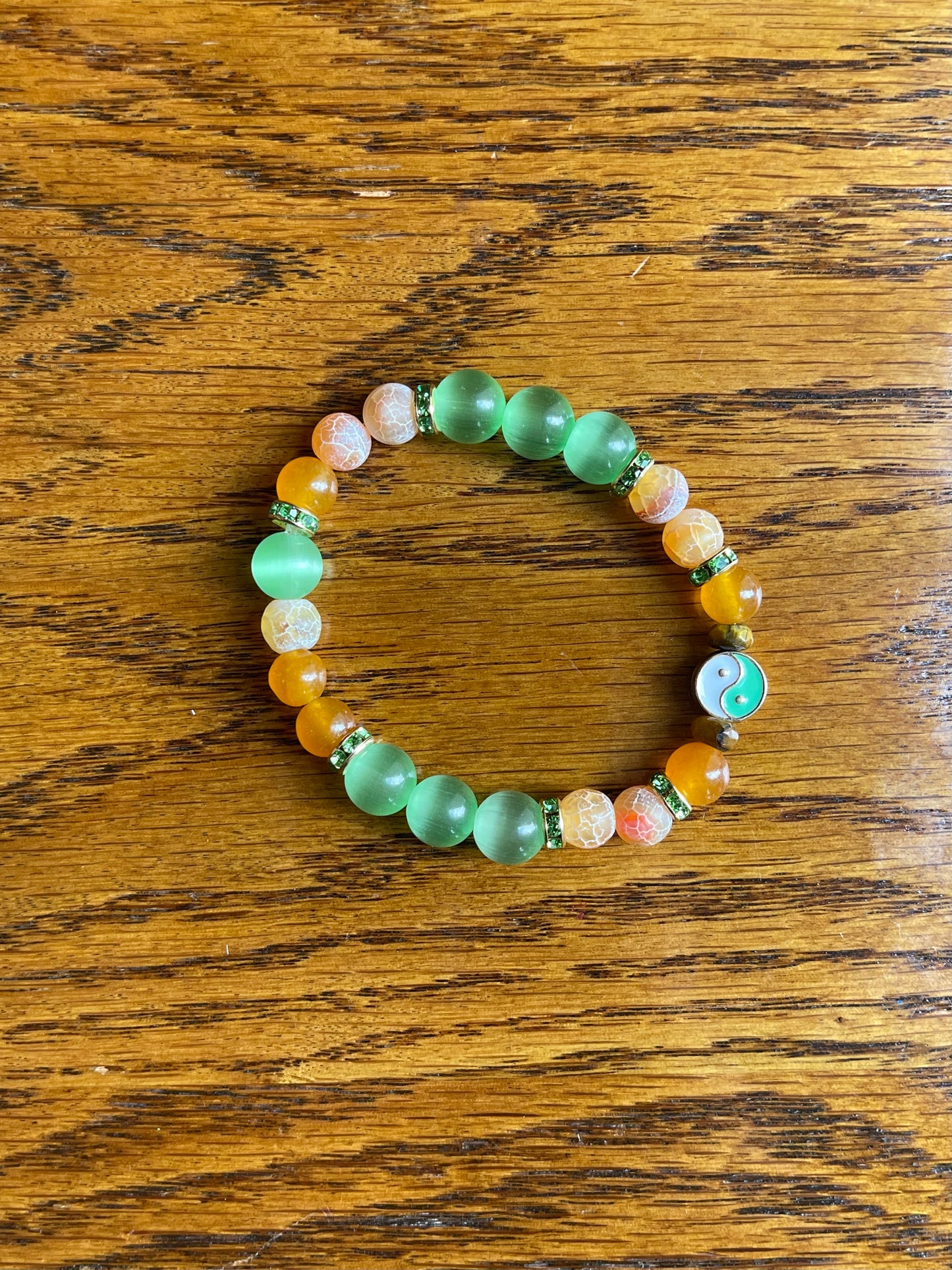Cat’s eye with crackle agate, quartz, tiger’s eye bracelet, with green yin & yang symbol
