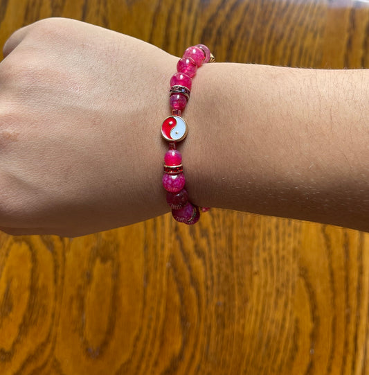 Pink crackle agate bracelet, with red yin & yang symbol
