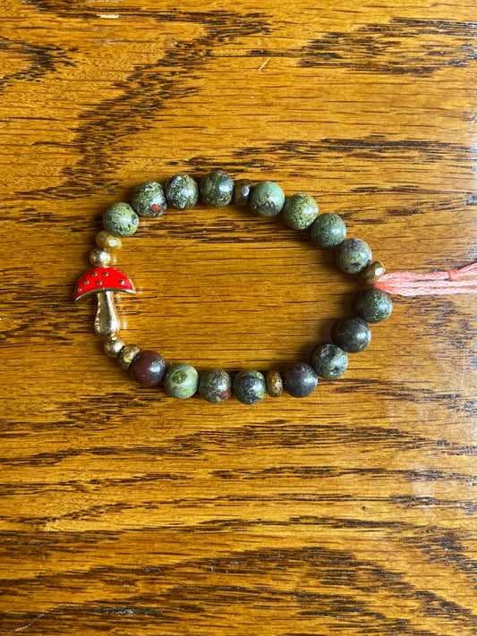 Dragon’s blood stone bracelet with red mushroom charm