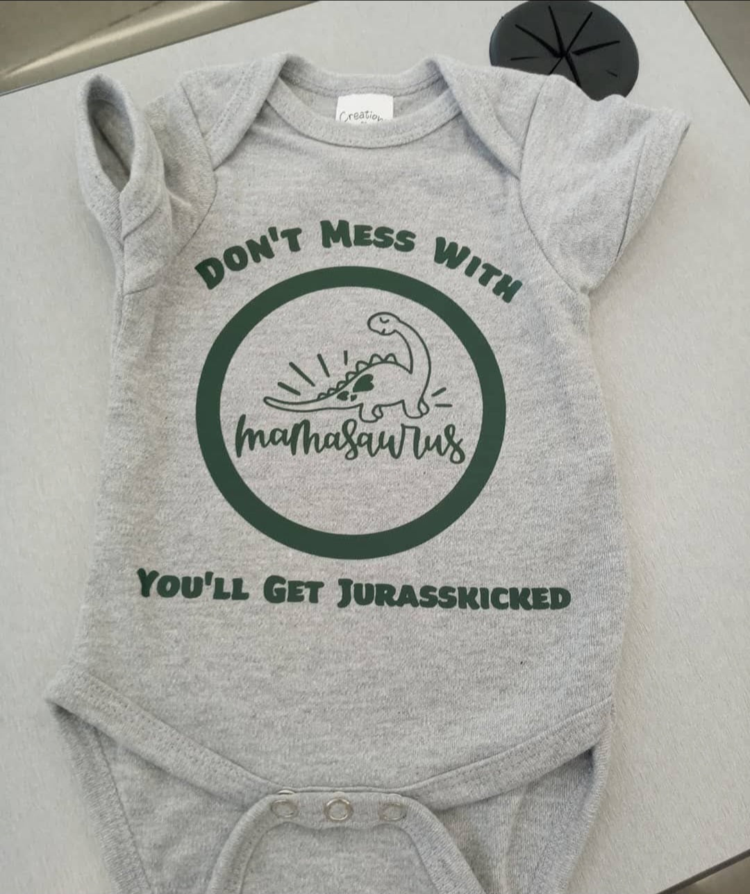 Jurasskicked onsie